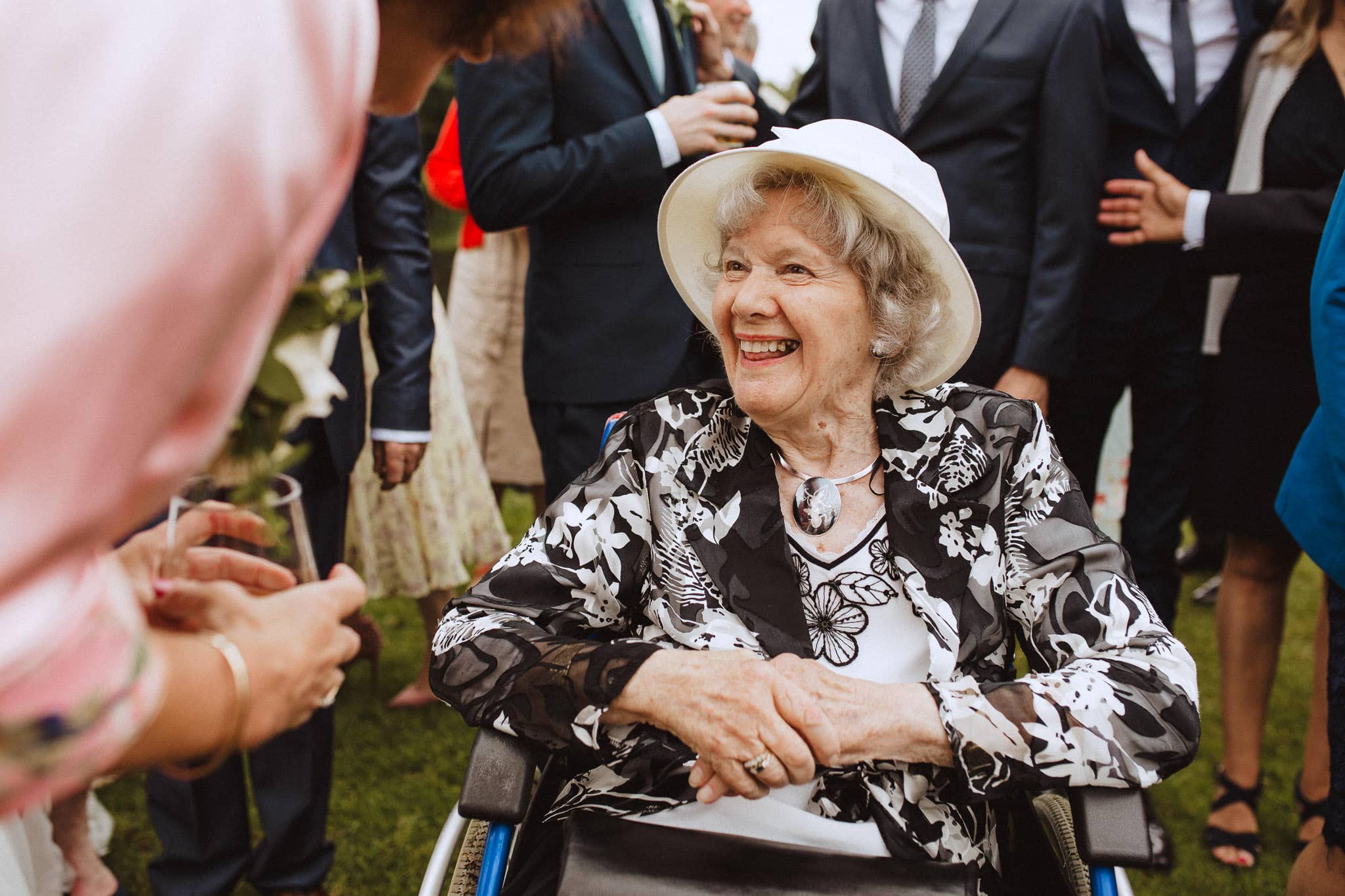 grandma caught in candid photo enjoying the wedding reception