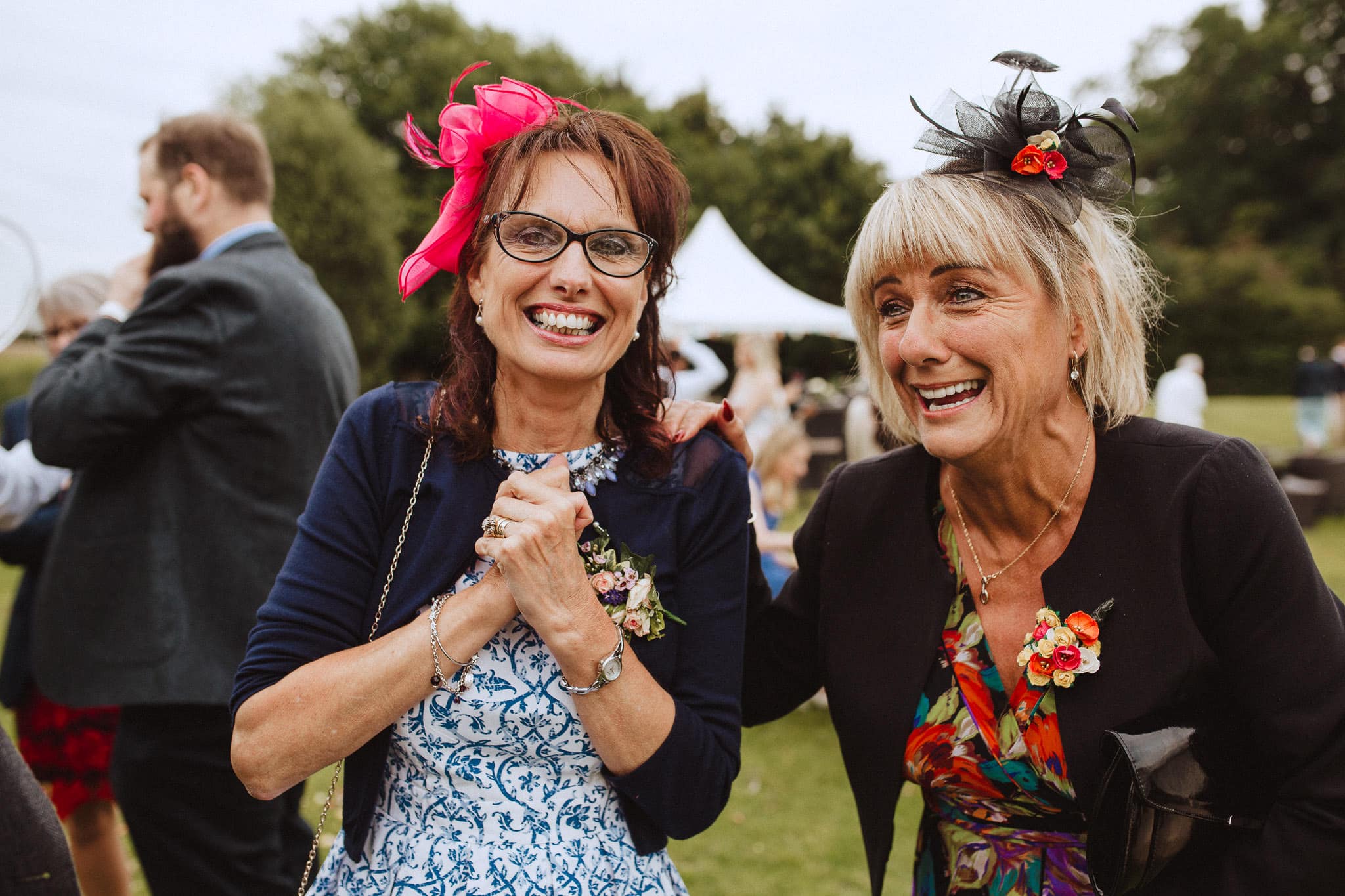 guests laughing outside the marquee at a wedding in Leicestershire