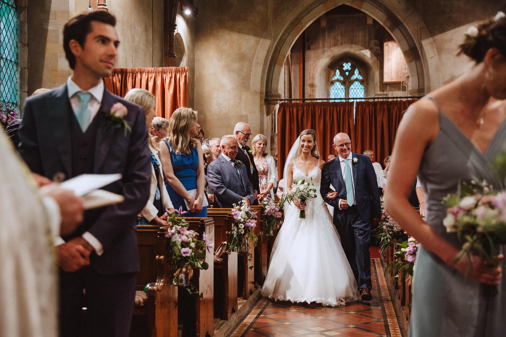 bride walking down the aisle at her Leicestershire wedding