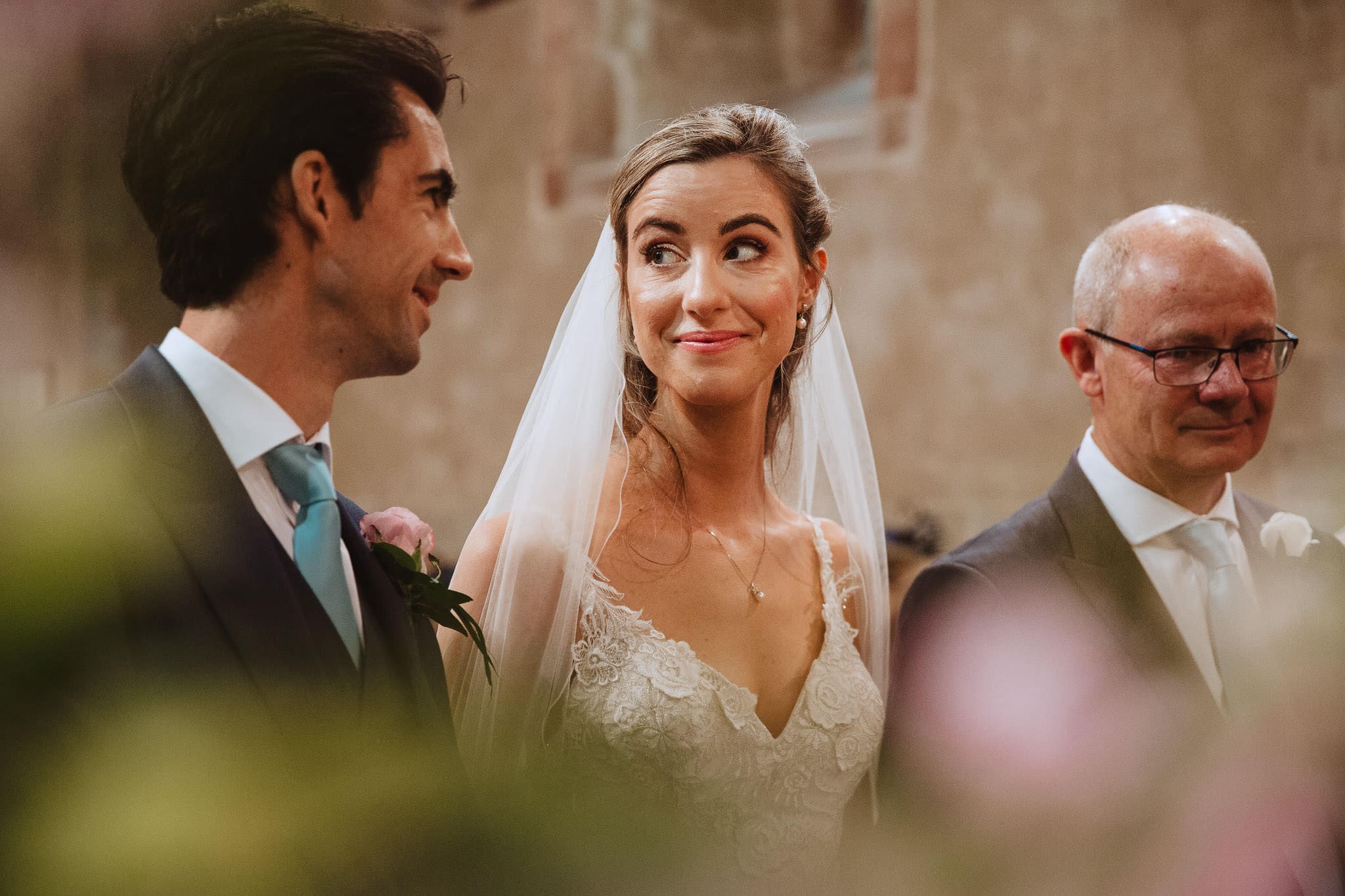 close up photo of bride and groom exchanging looks during their wedding ceremony