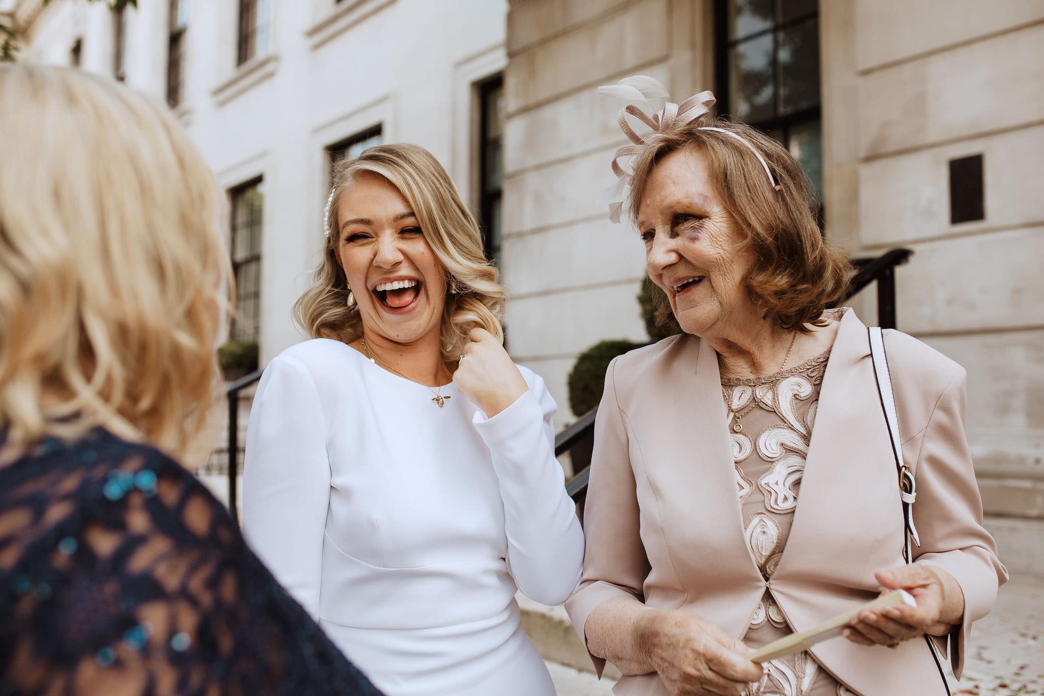 candid shot of bride laughing