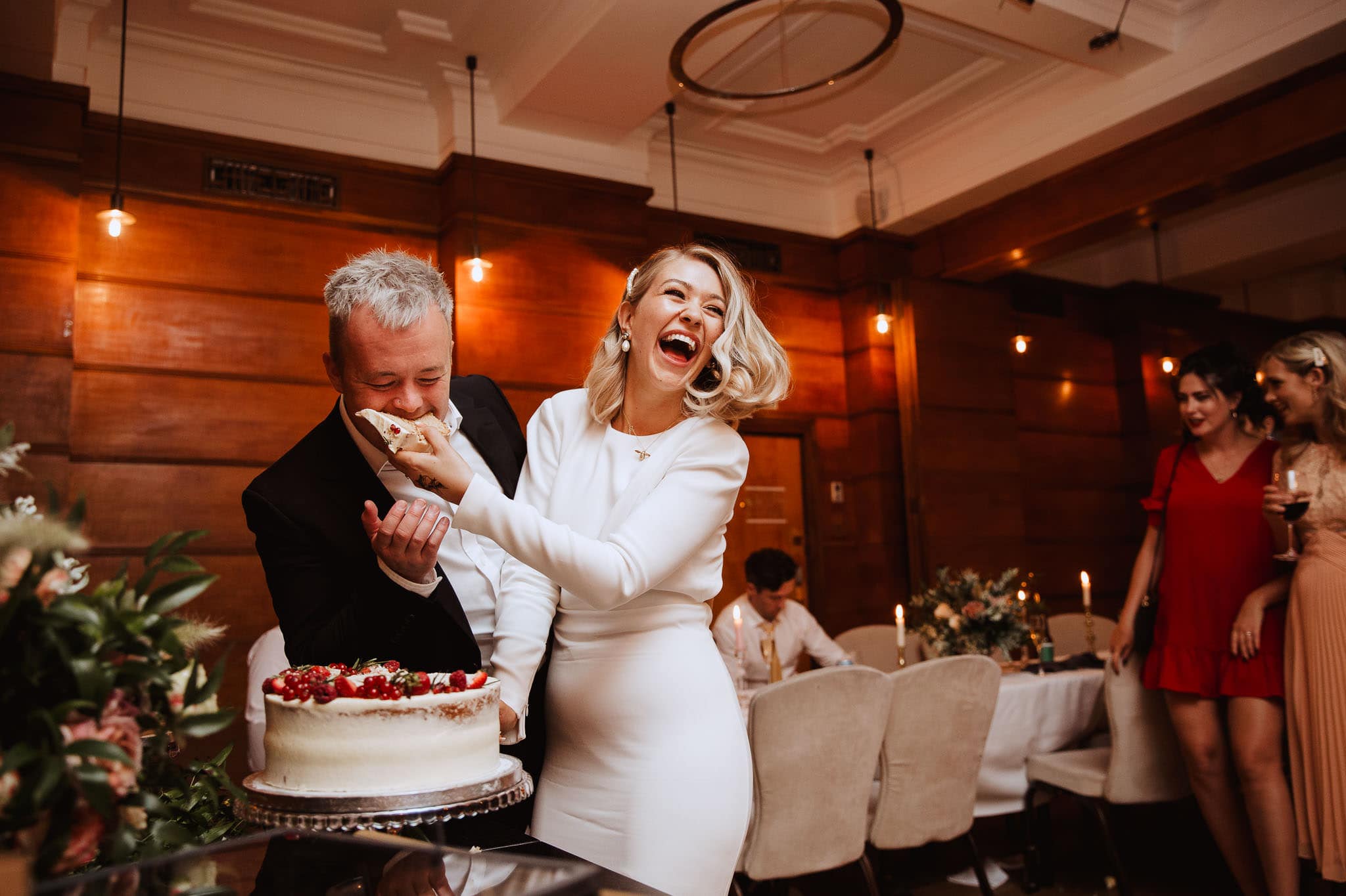 cutting the cake Town Hall Hotel Wedding, London