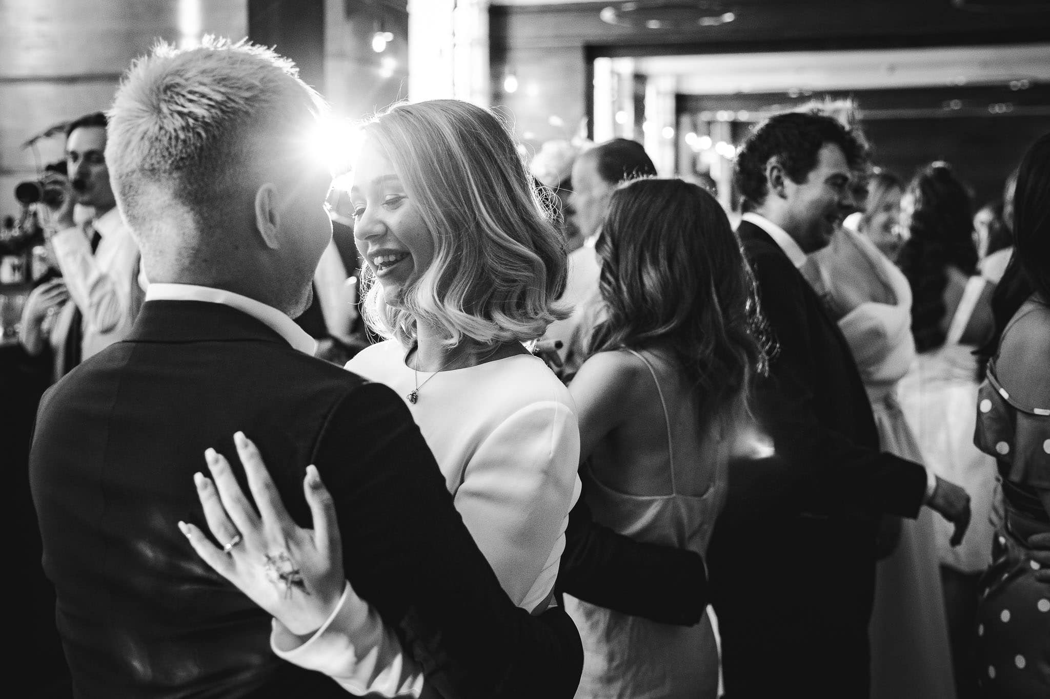 black and white photo on the dance floor at documentary wedding photography Town Hall Hotel Wedding, London