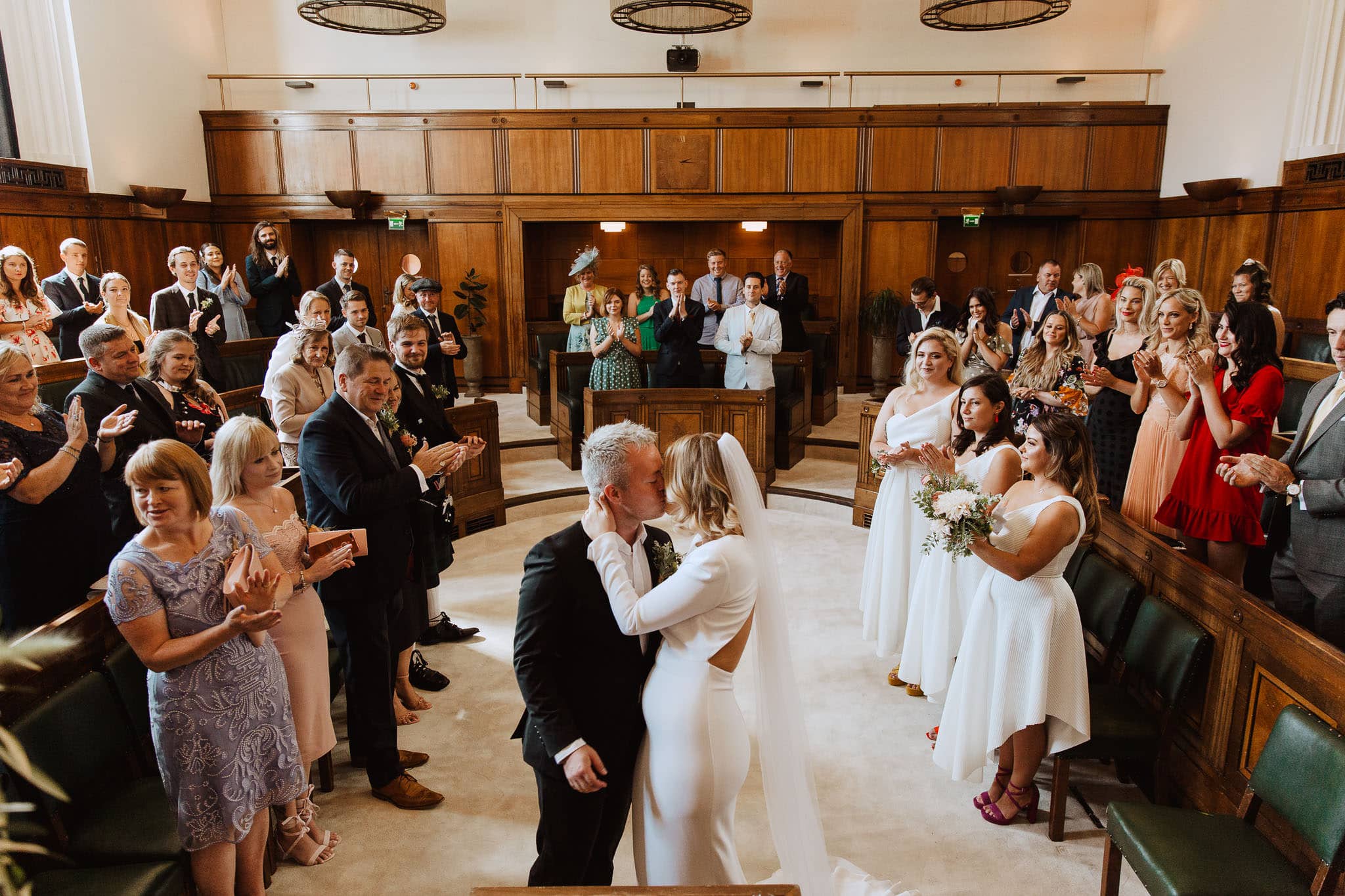 first kiss at Town Hall Hotel Wedding