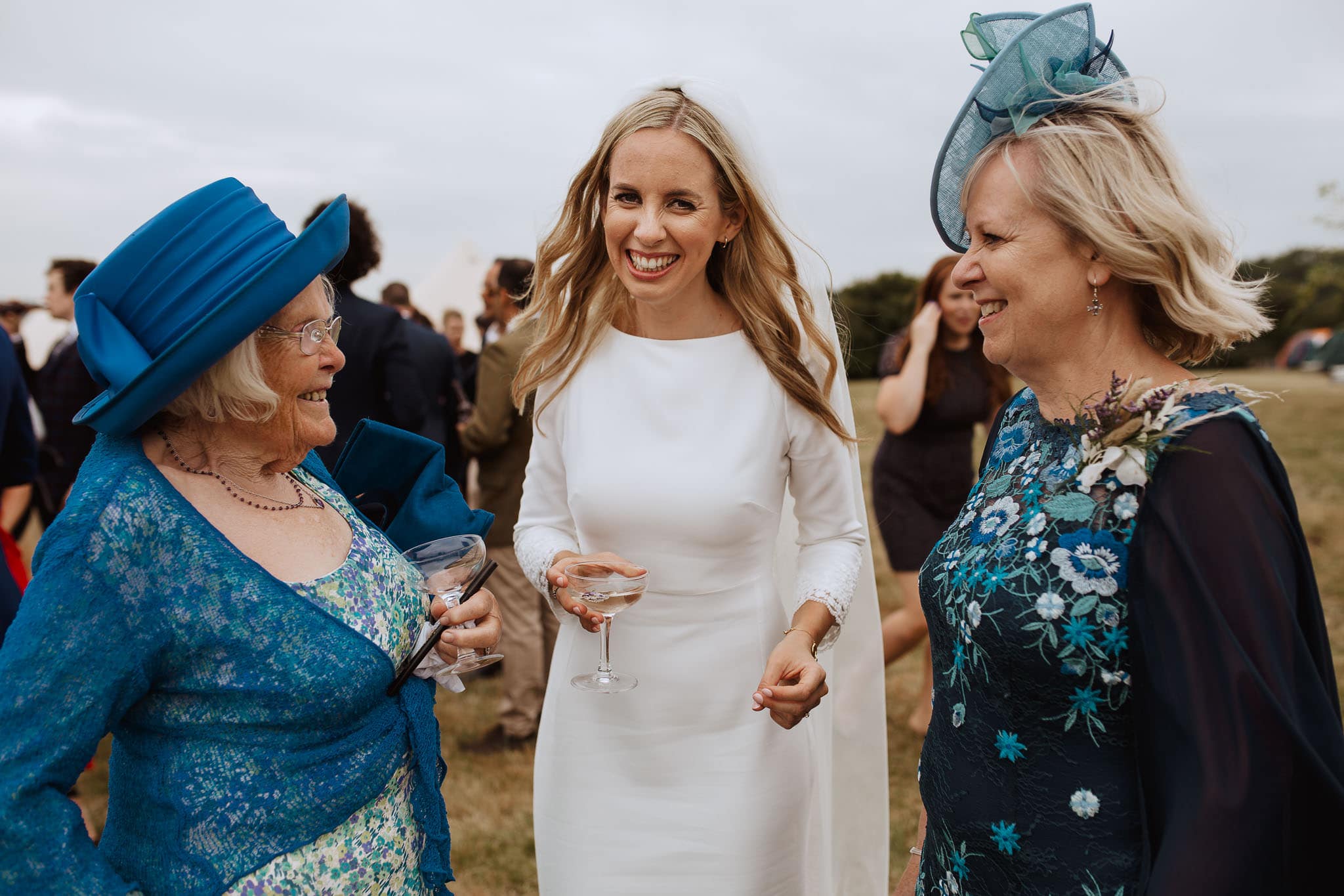 Rime Arodaky Bride laughing with her wedding guests