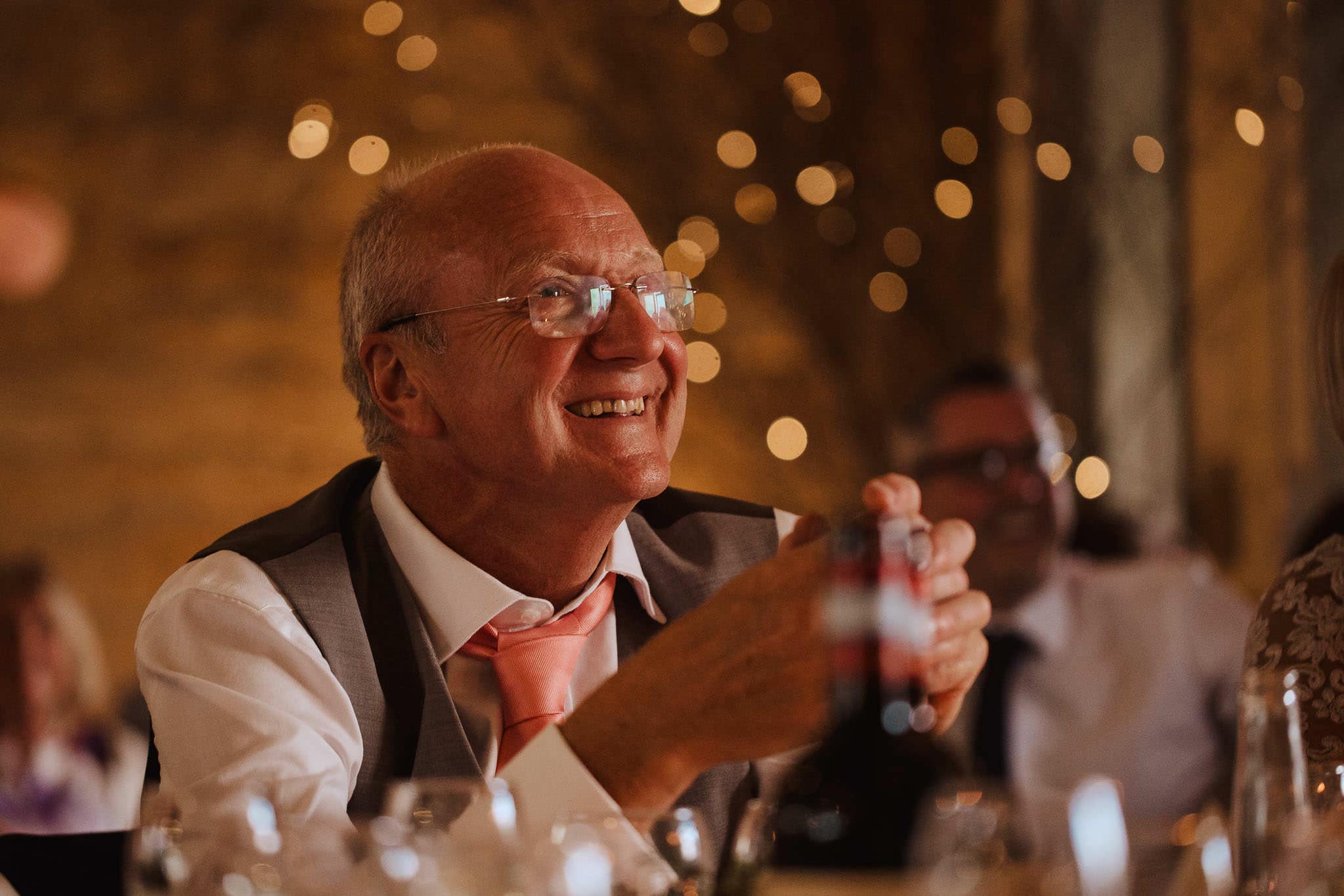 close up of Dad laughing during wedding speeches