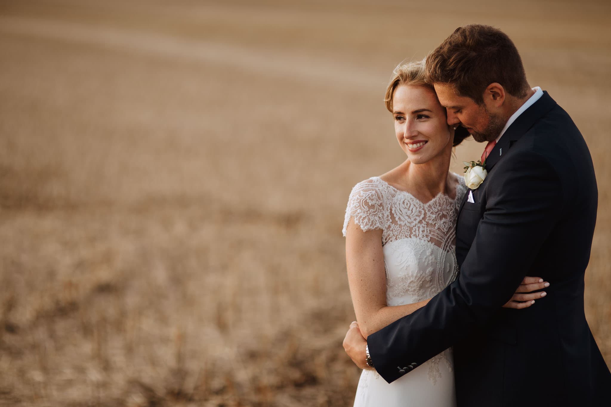 bride and groom in field at Lapstone Barn Wedding venue The Cotswolds