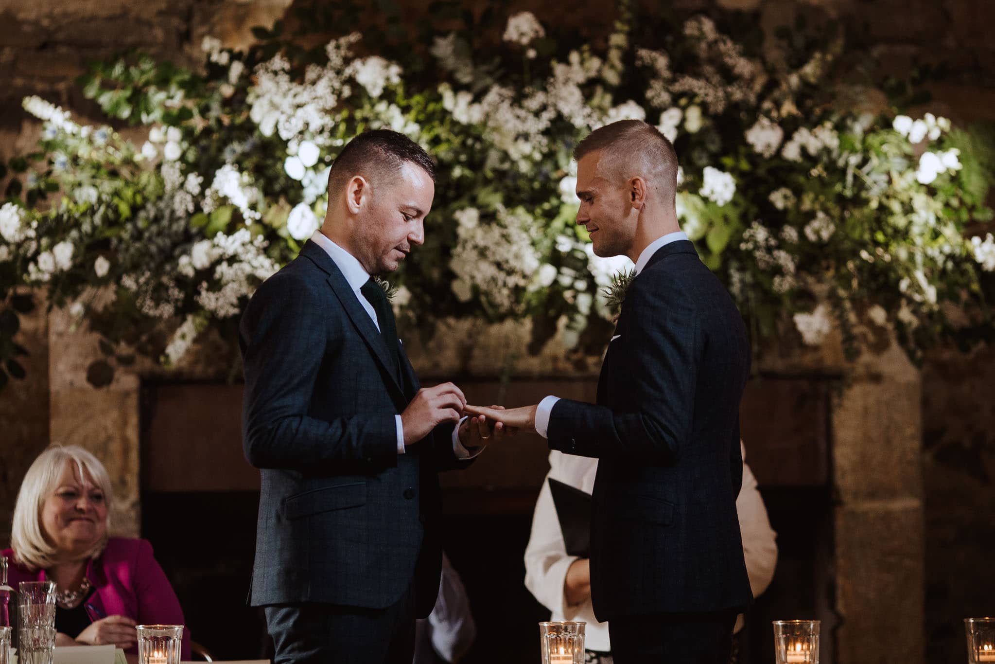 grooms exchanging  rings at Healey Barn wedding