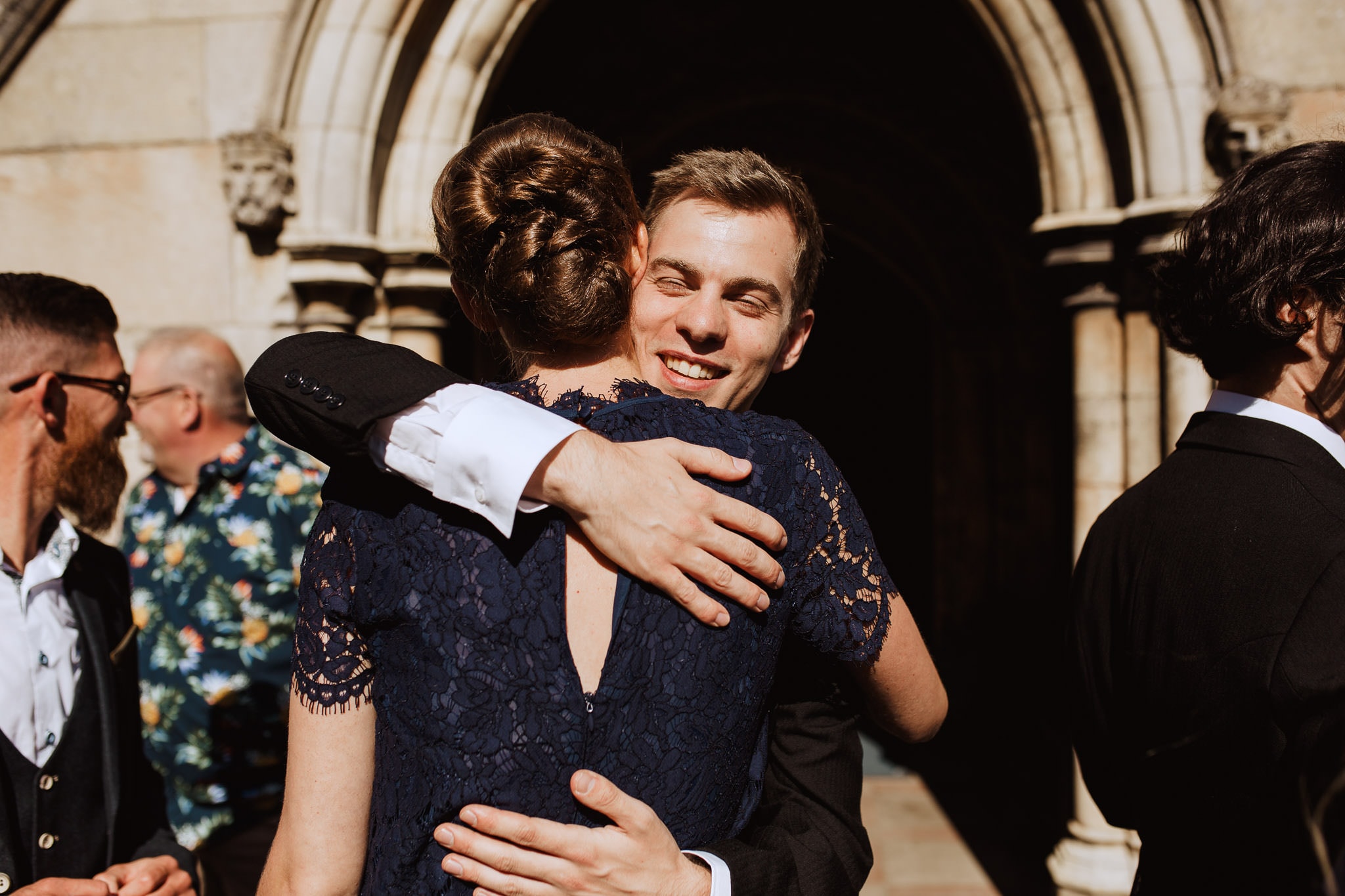 groom hugging his friend before the ceremony