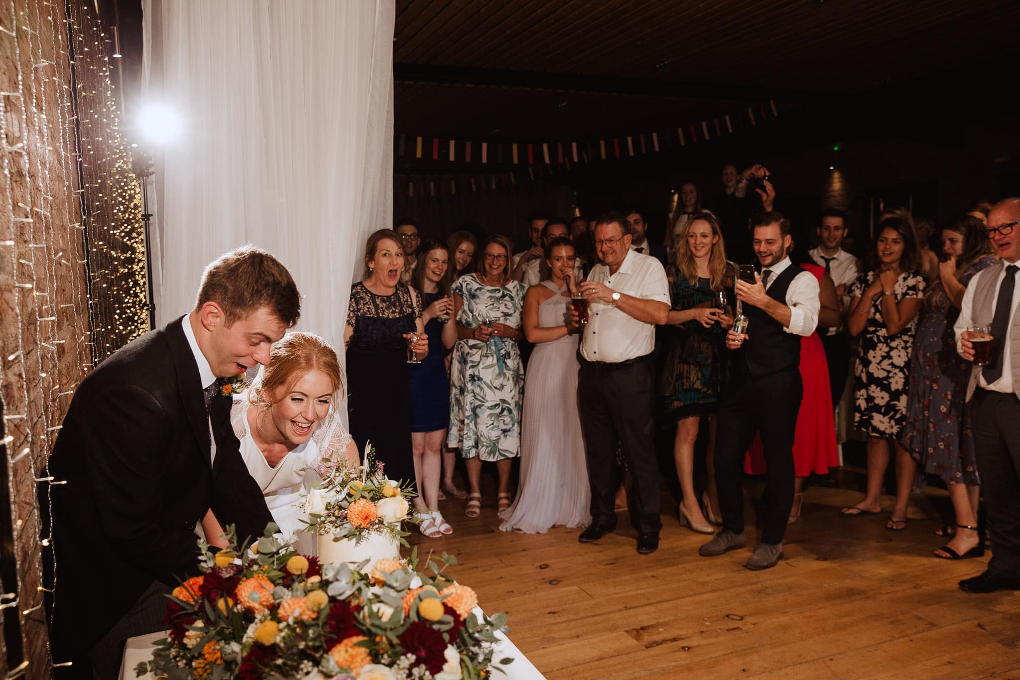 cutting the cake Norton Fields wedding