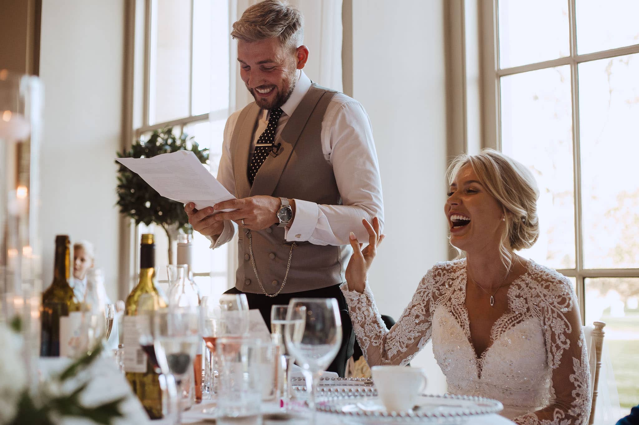 bride laughing at groom's speech