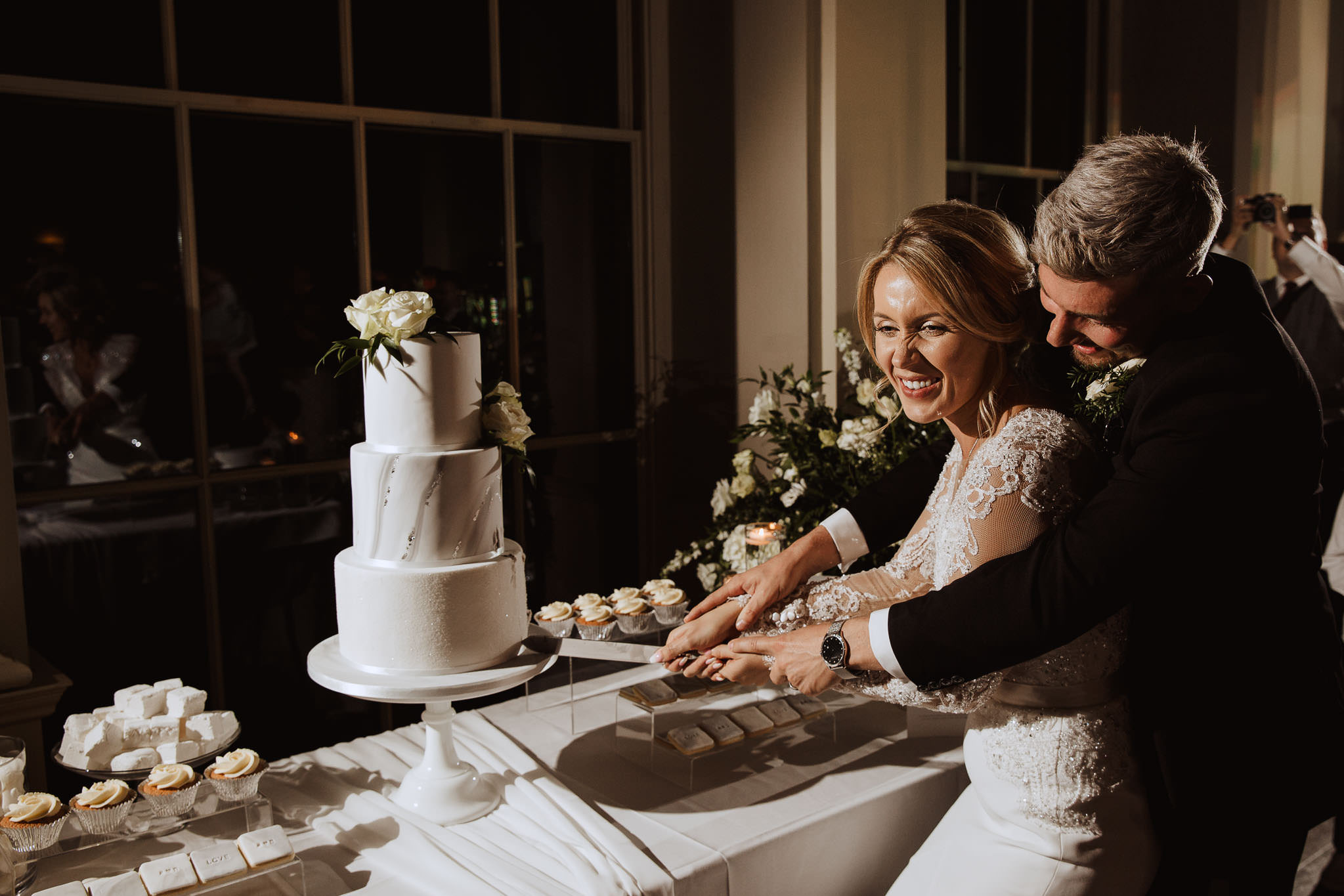 cutting the cake Stubton Hall wedding photography