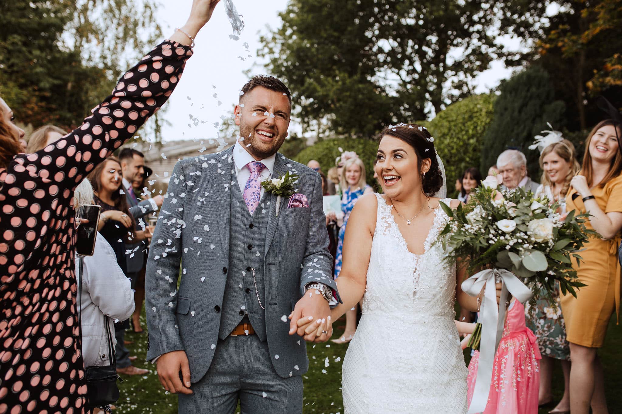 confetti in the gardens at Newton House Barns Wedding