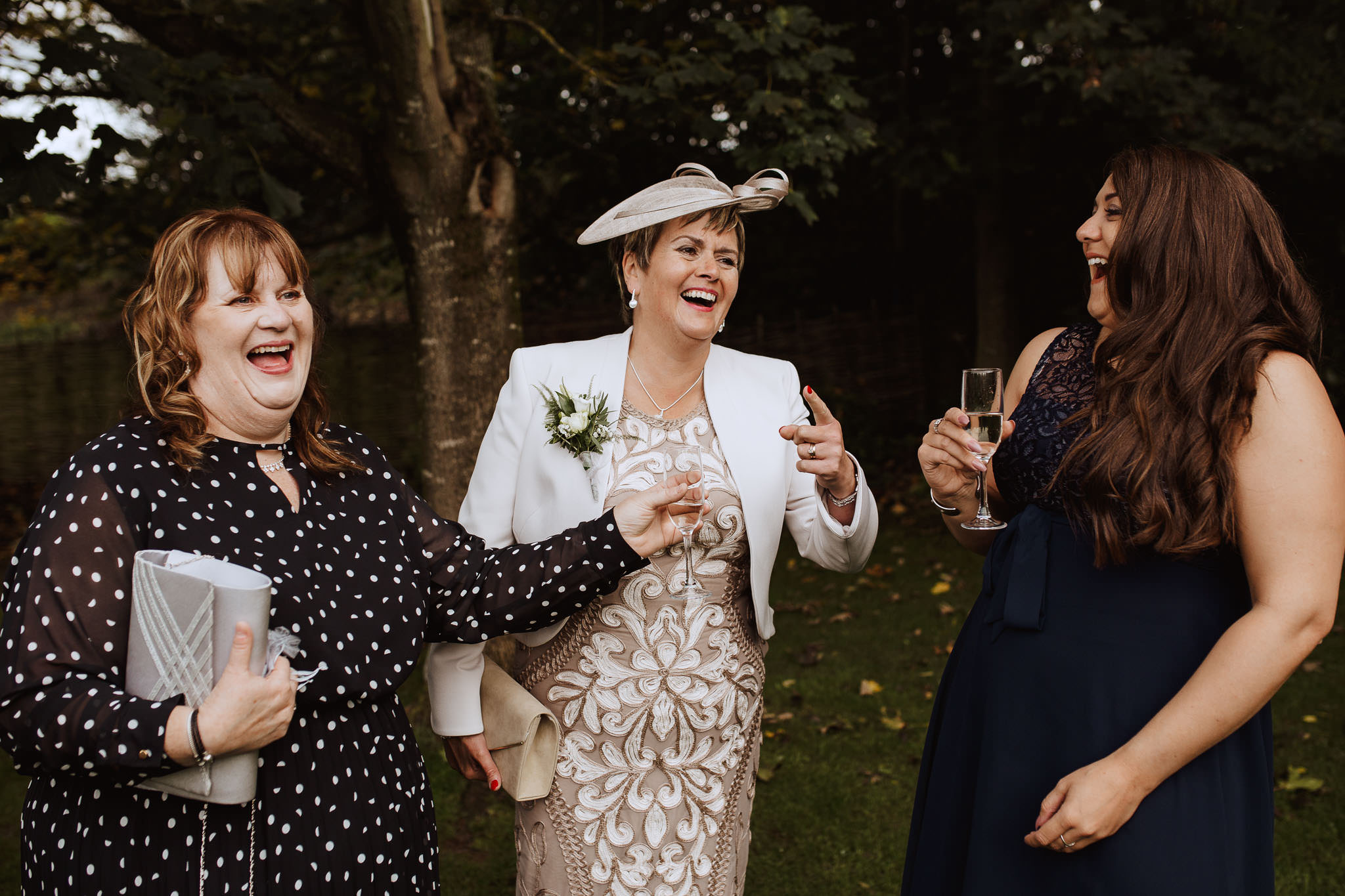 guests laughing captured by documentary style photographer in Derbyshire