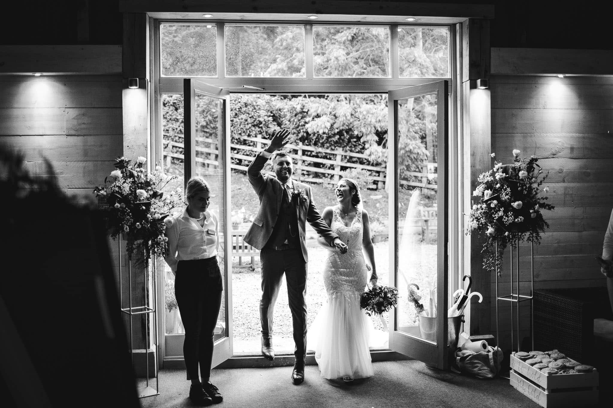 bride and groom's entrance to the barn at Newton House Barns Wedding