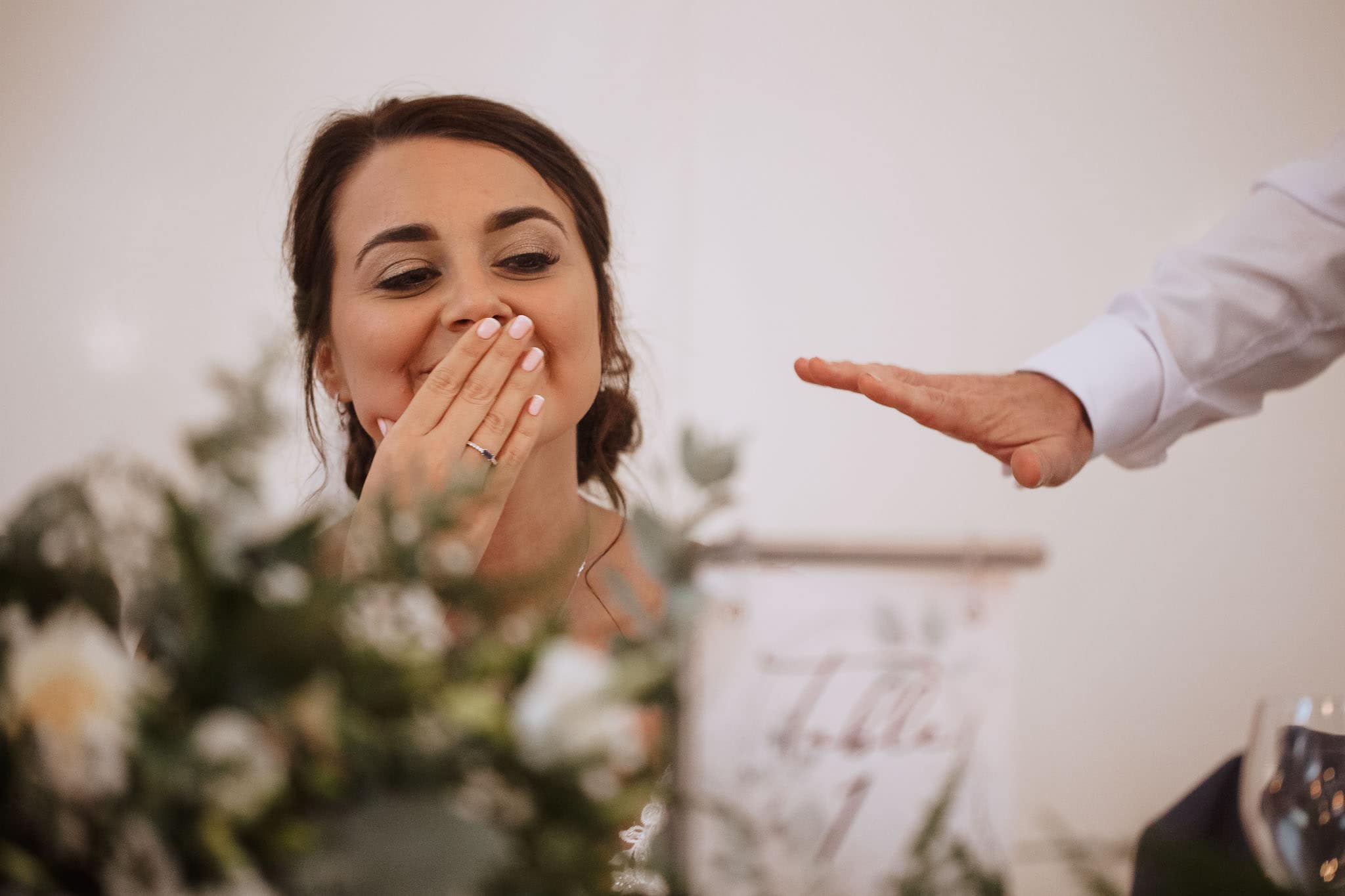 close up of bride's shock horror during speech
