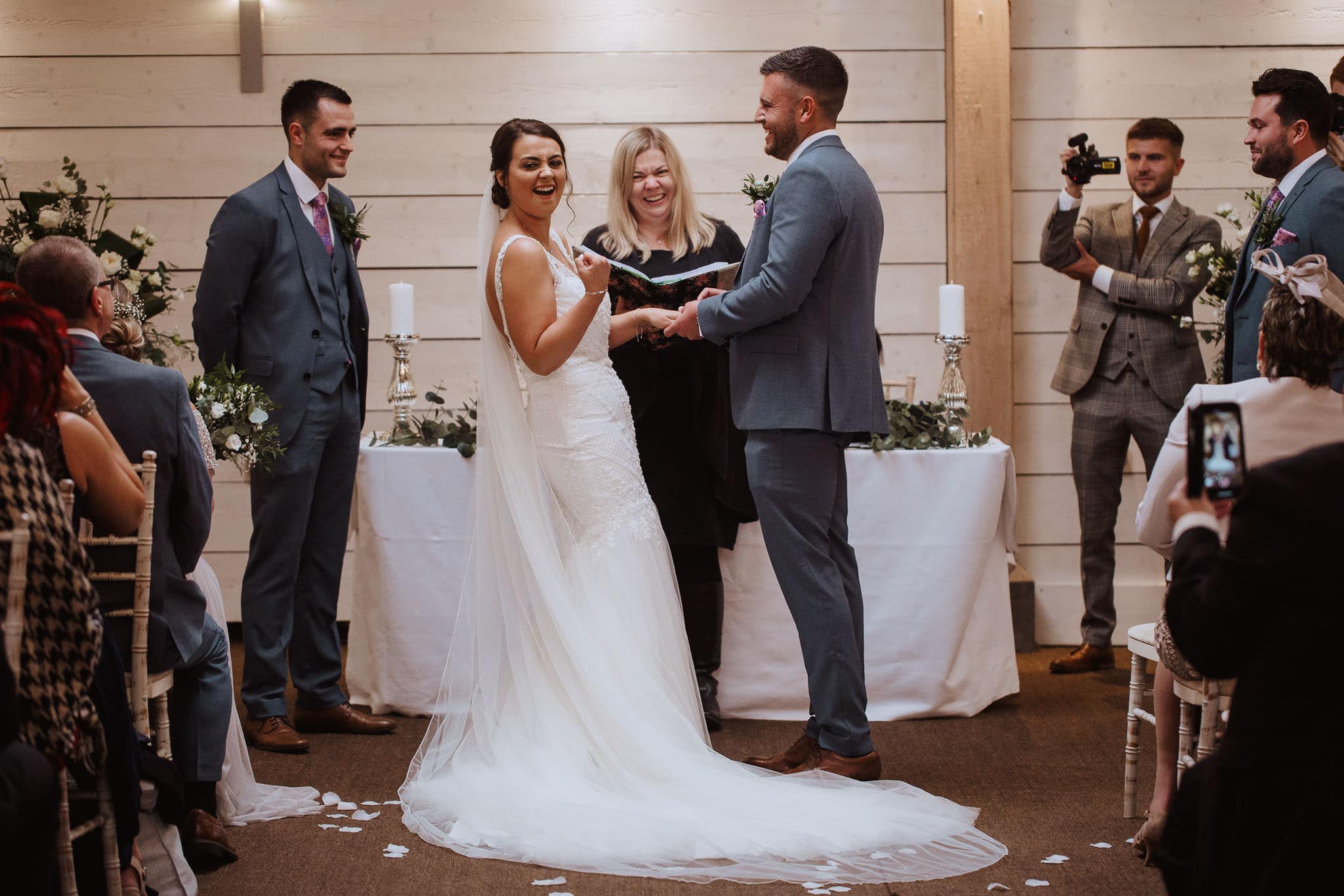 bride fist pump during Newton House Barns Wedding ceremony