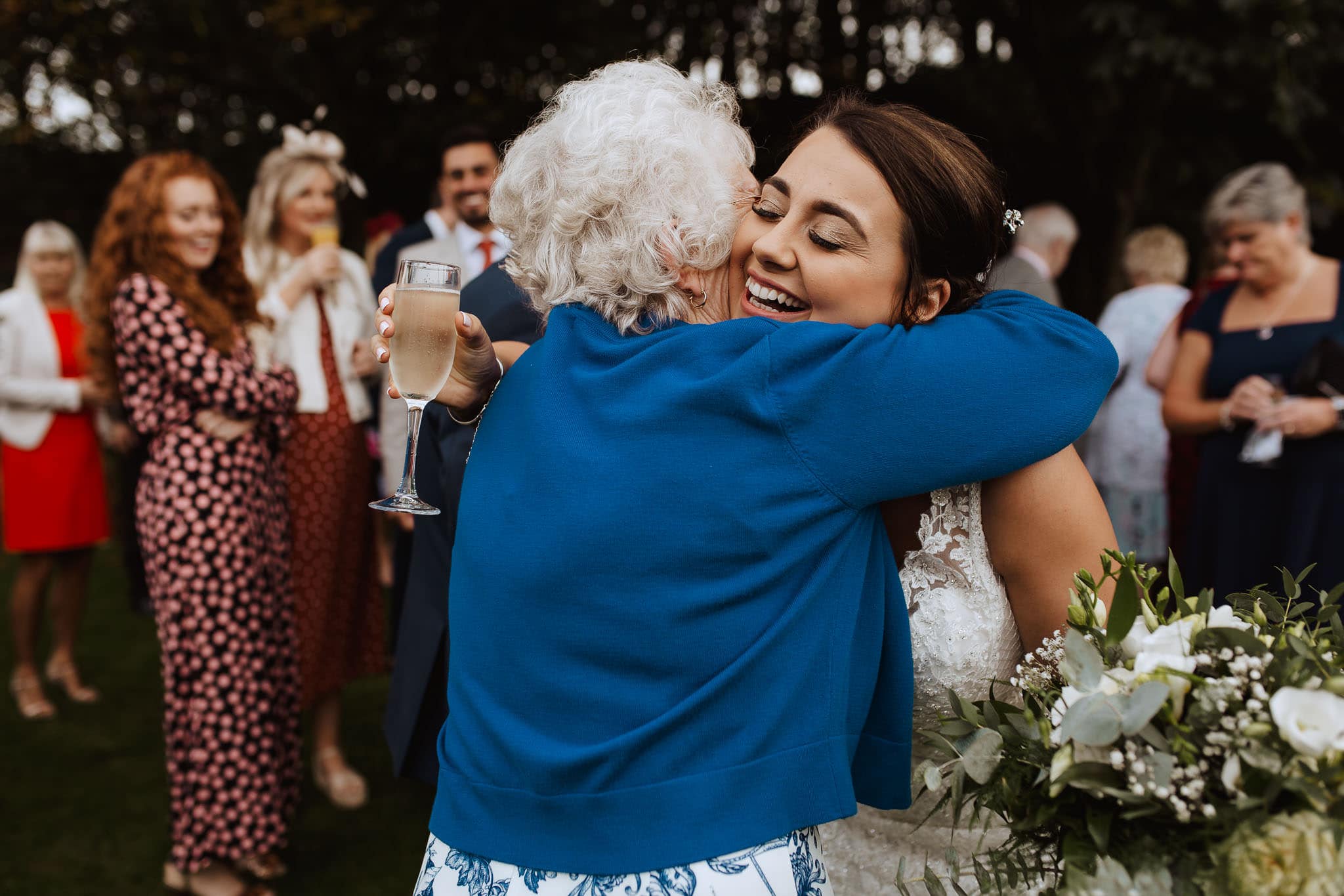bride hugging her grandma in the garden at Newton House Barns Wedding