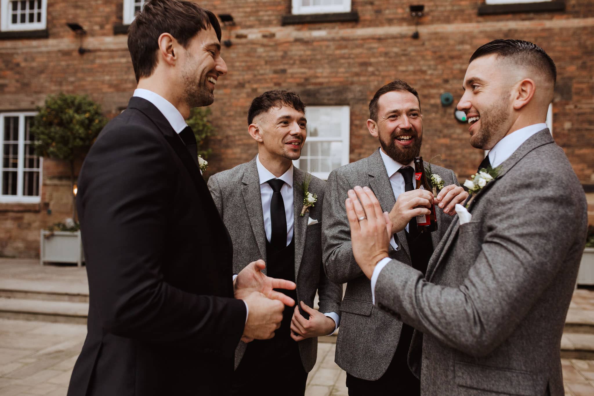 candid shot of groom and ushers at Derby wedding