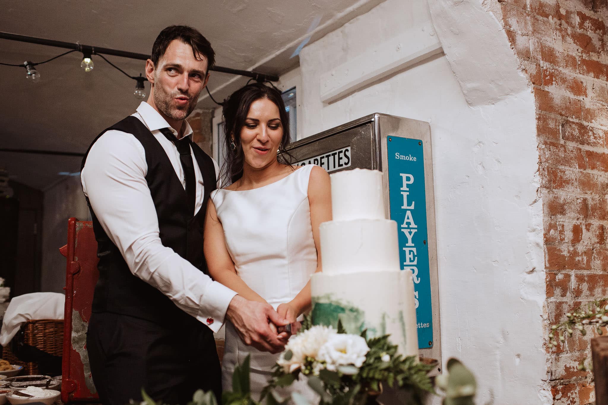 cool cake cut shot at Derby Wedding