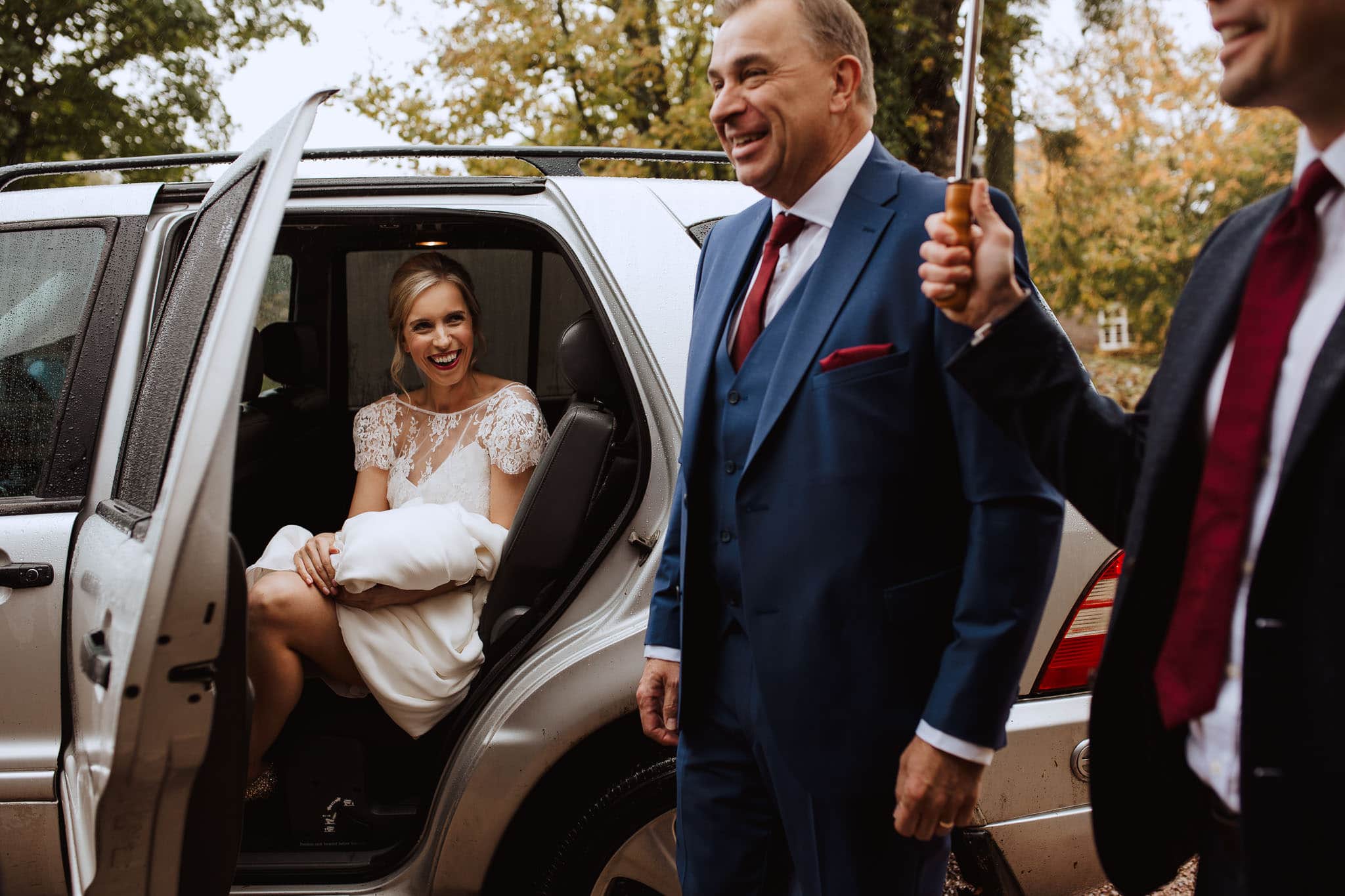 bride arriving for her rainy day ceremony