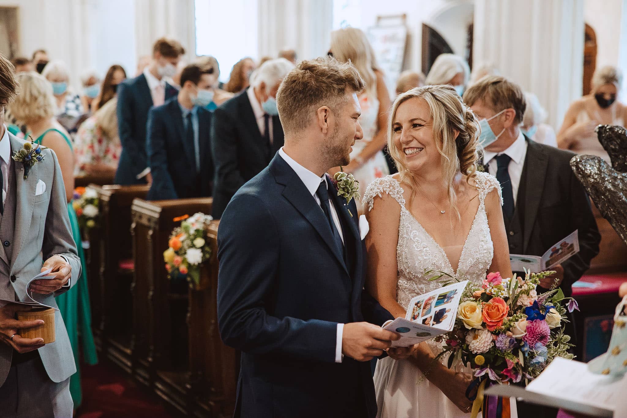 happy bride and groom photographed during wedding ceremony
