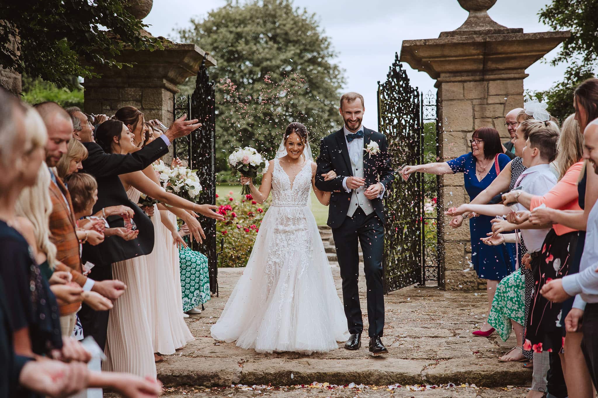 Red on Blonde Photography Hooton Pagnell Hall wedding confetti shot