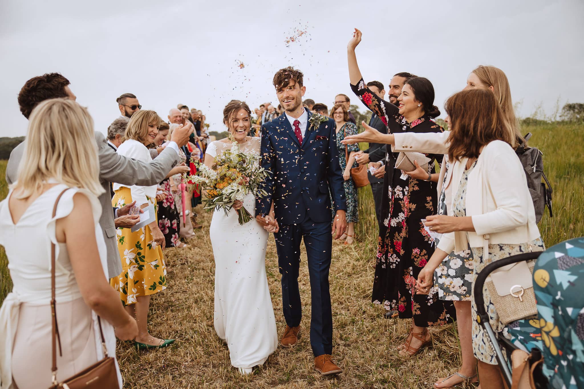 confetti shot at wedding in a field
