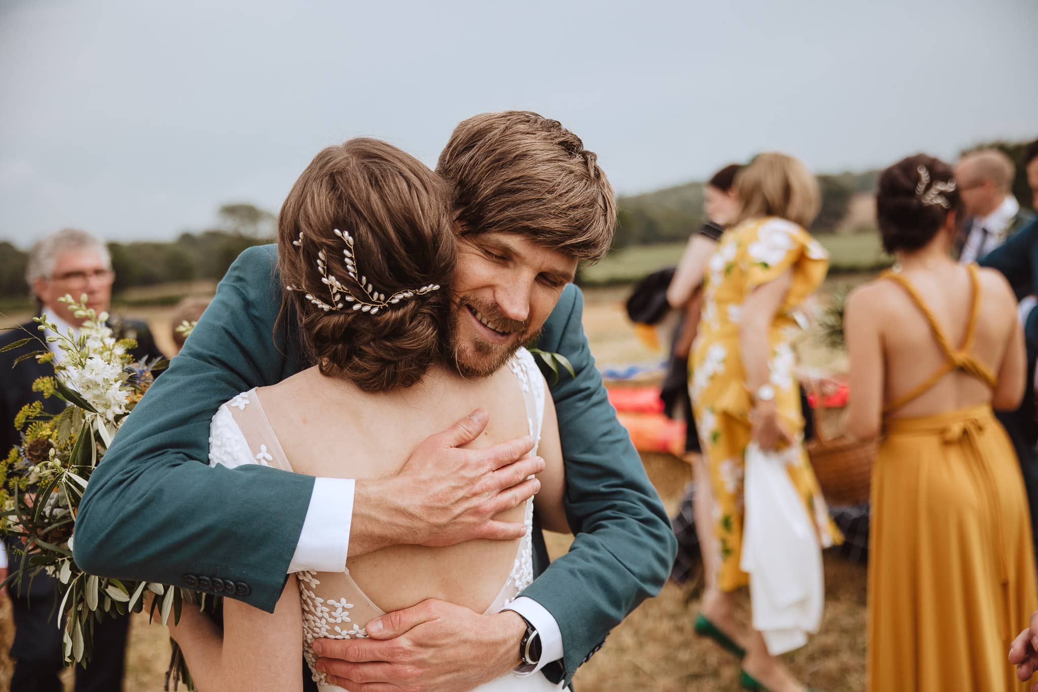 close up documentary photo of bride hugging her brother in law