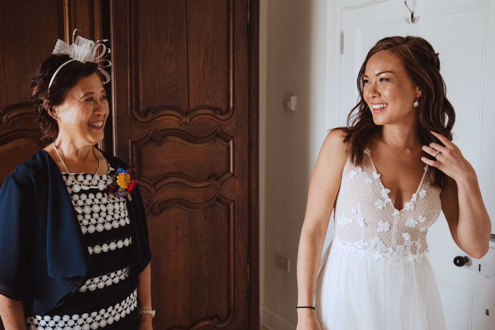 beautiful asian bride in Anna Kara wedding dress, laughing with her Mum