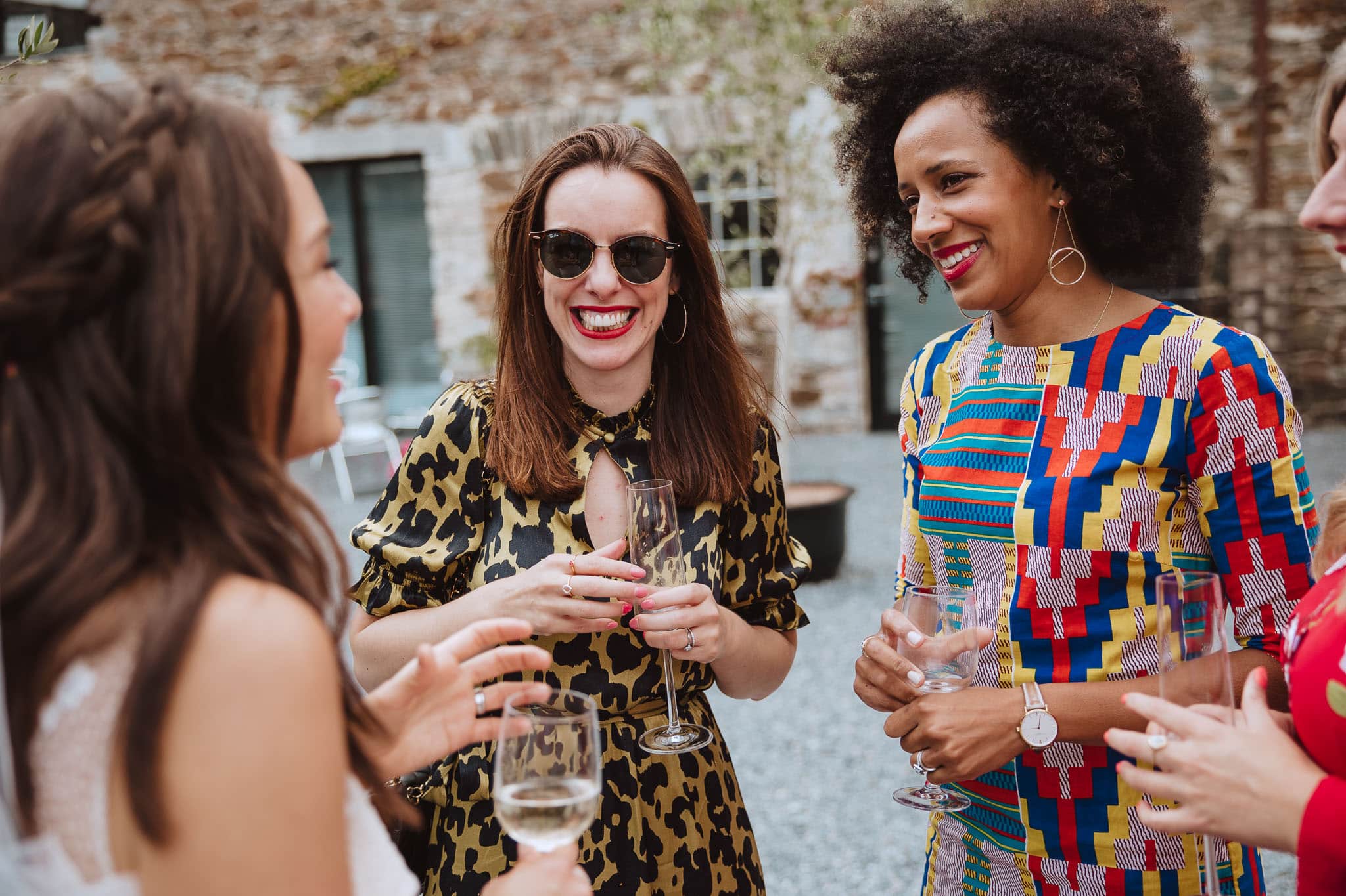 wedding guests in colourful outfits