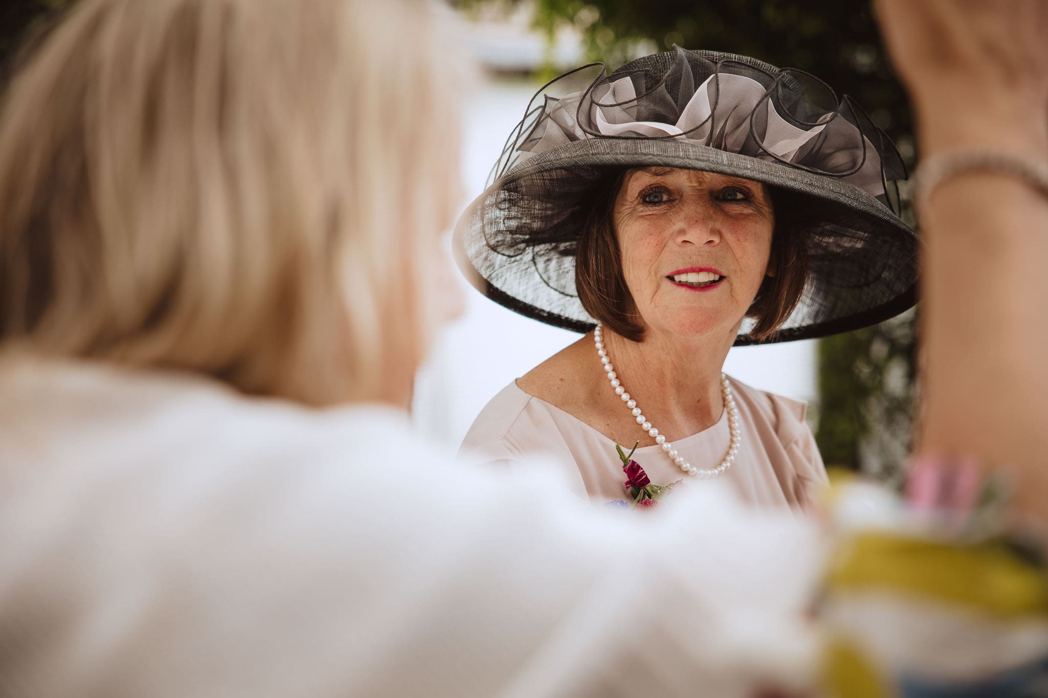 wedding guest in elegant hat