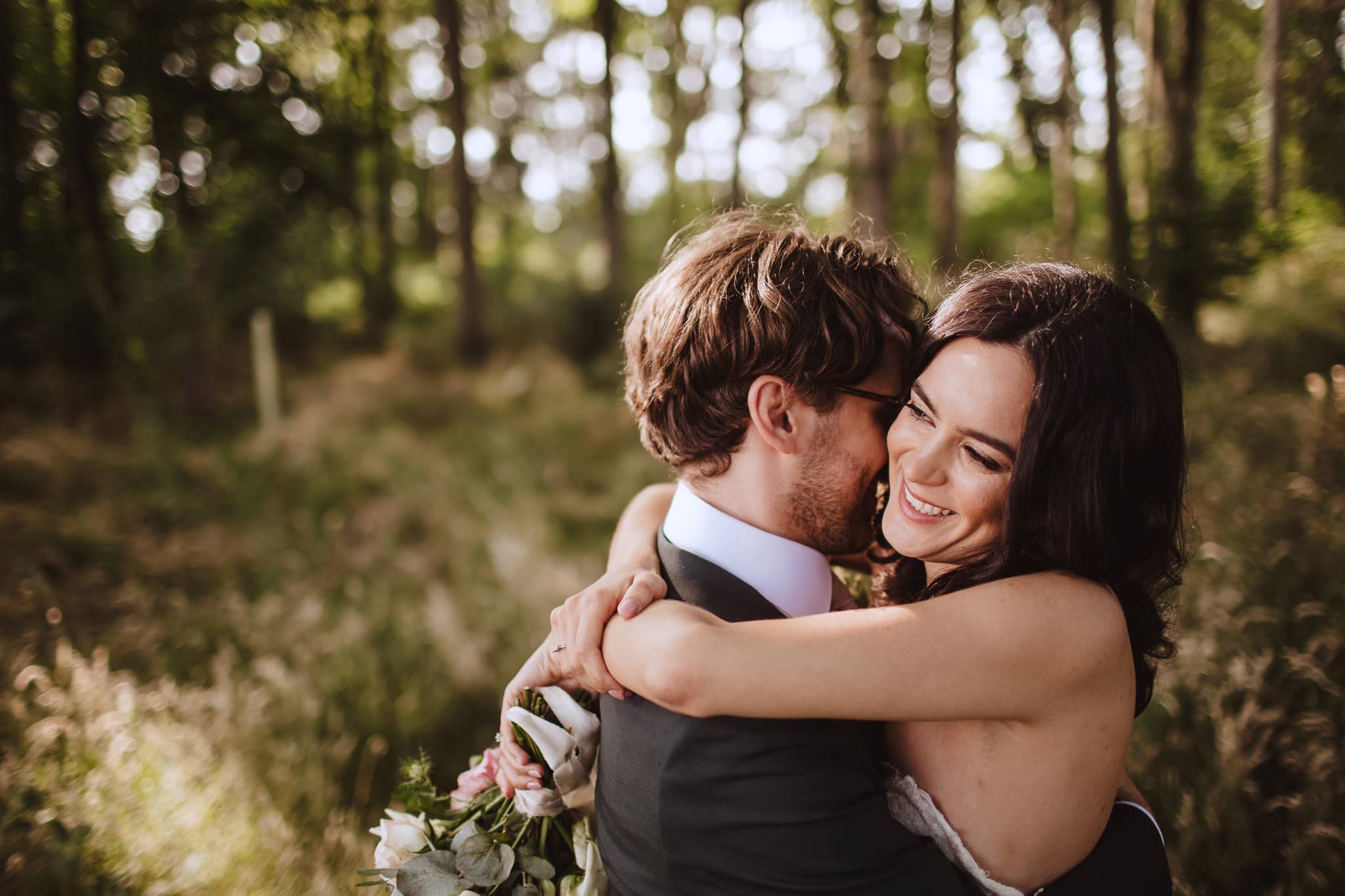 close up portrait of bride and groom in the woodland at Wilderness Reserve, Suffolk