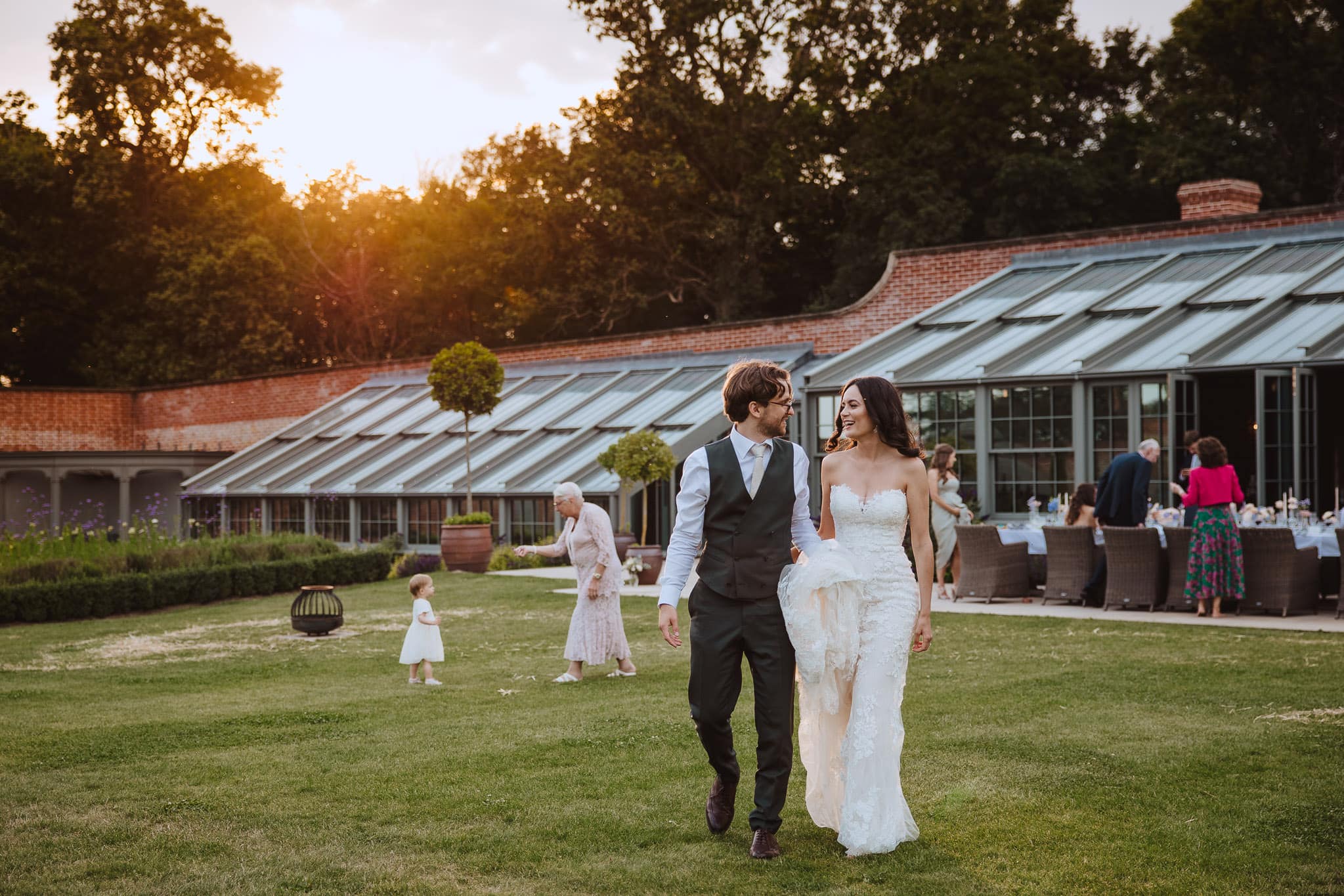 bride and groom walking to sunset portraits at Wilderness Reserve wedding