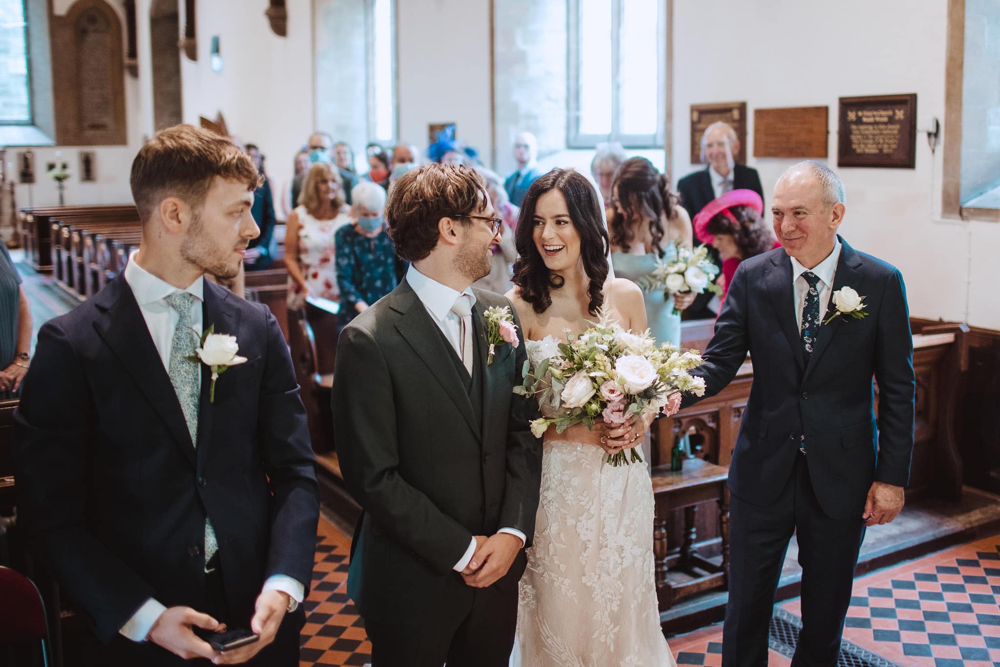 bride and groom greet each other for an intimate wedding ceremony