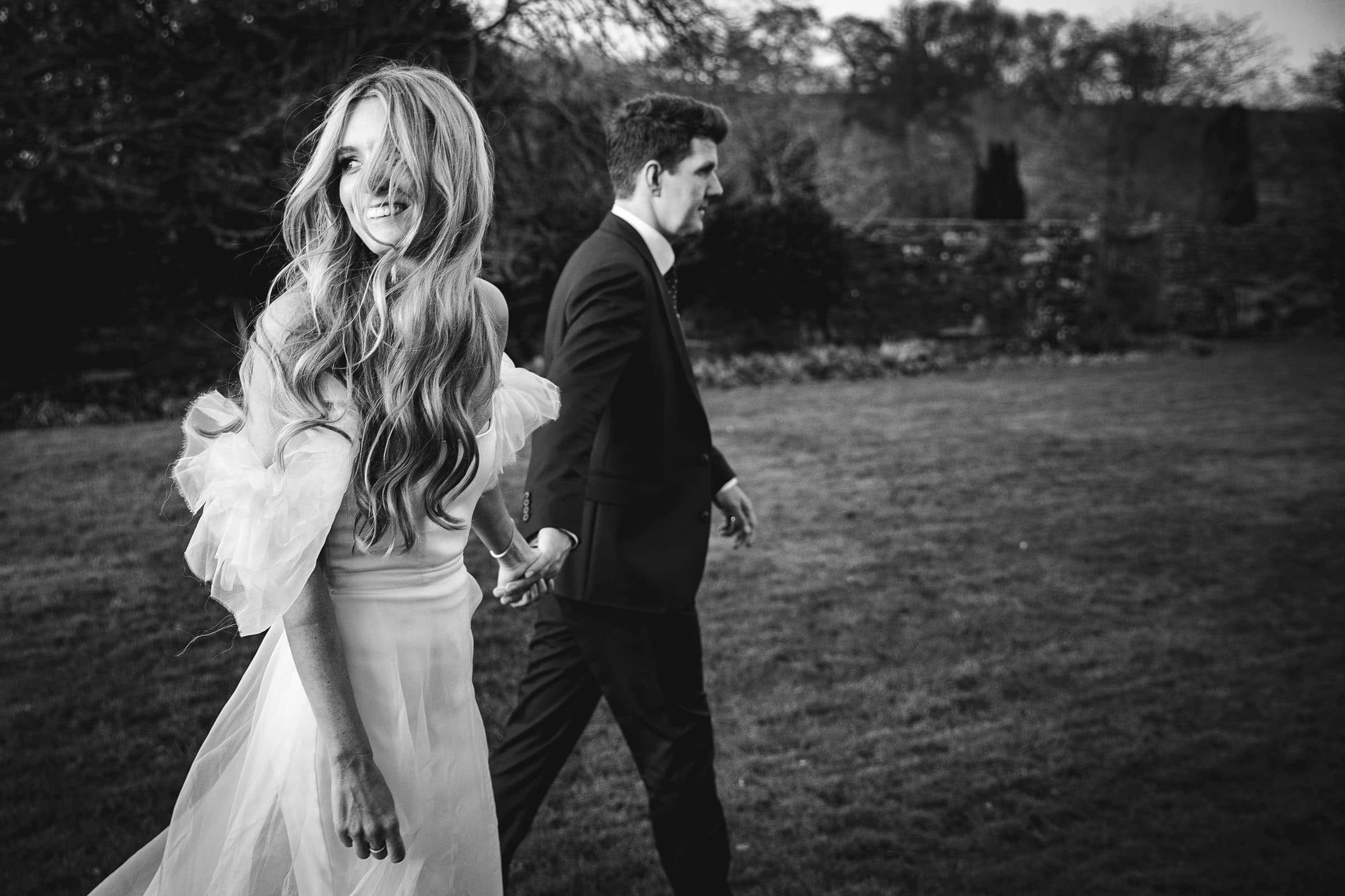 Bride and groom walking on their wedding day in derbyshire