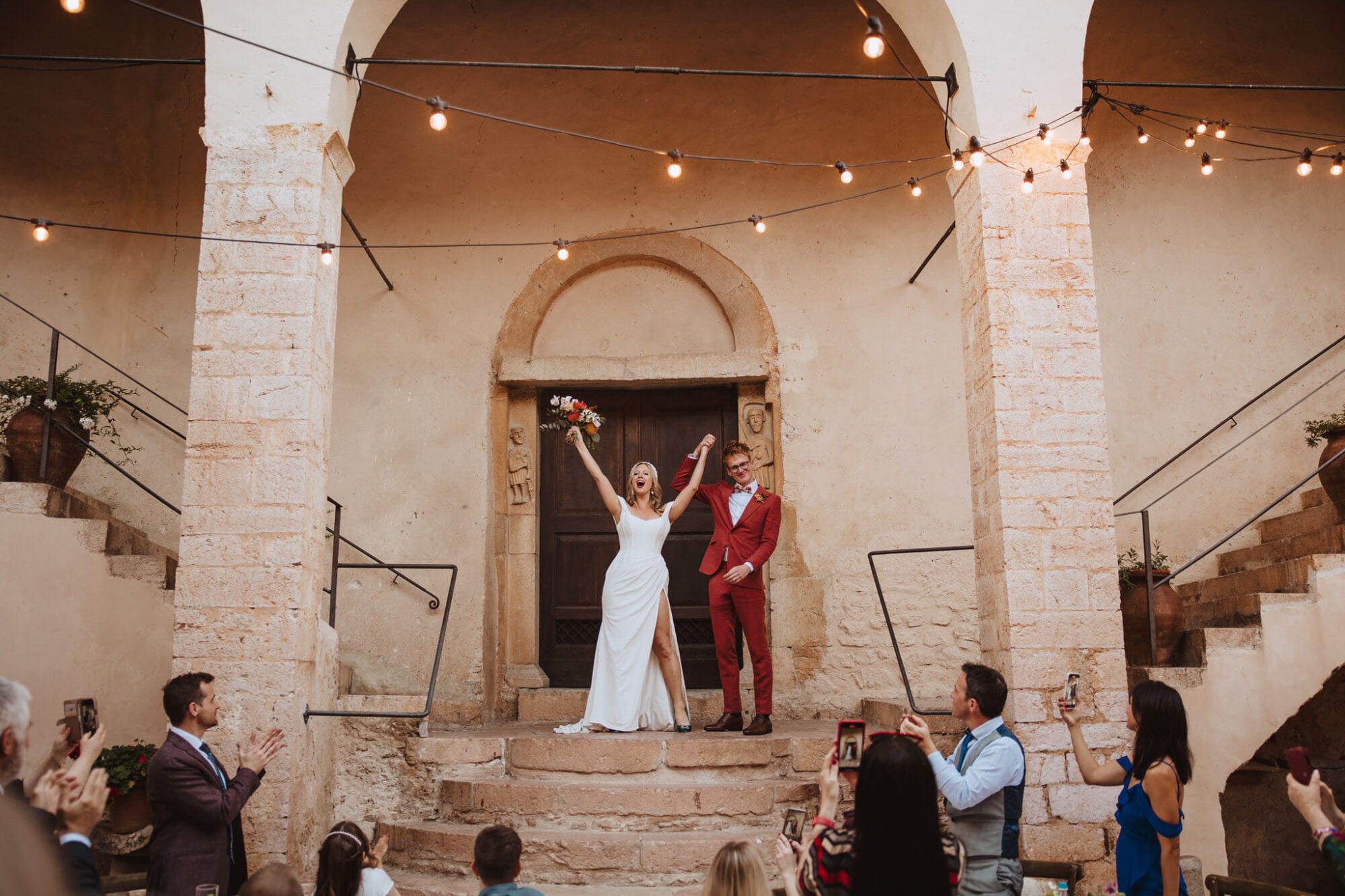 Bride and groom celebrating at destination wedding in Italy - Red on Blonde Photography